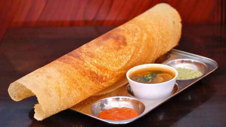 I personally love a smashing breakfast and South Indian food tops my list. Seen in pic: Traditional Dosa with sambar and chutnet